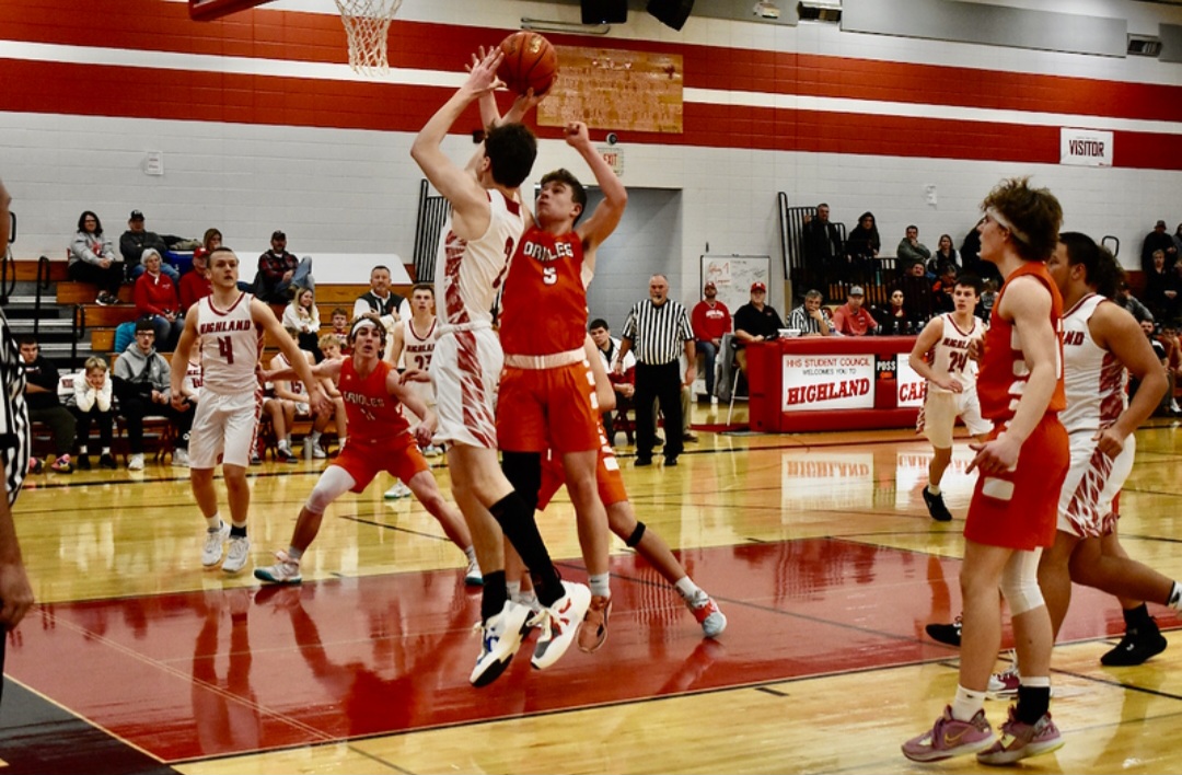 Michael Esser pulls up a contested jumper.